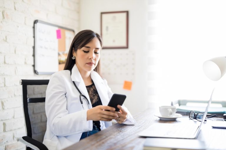 doctor reviewing training course material on mobile learning app